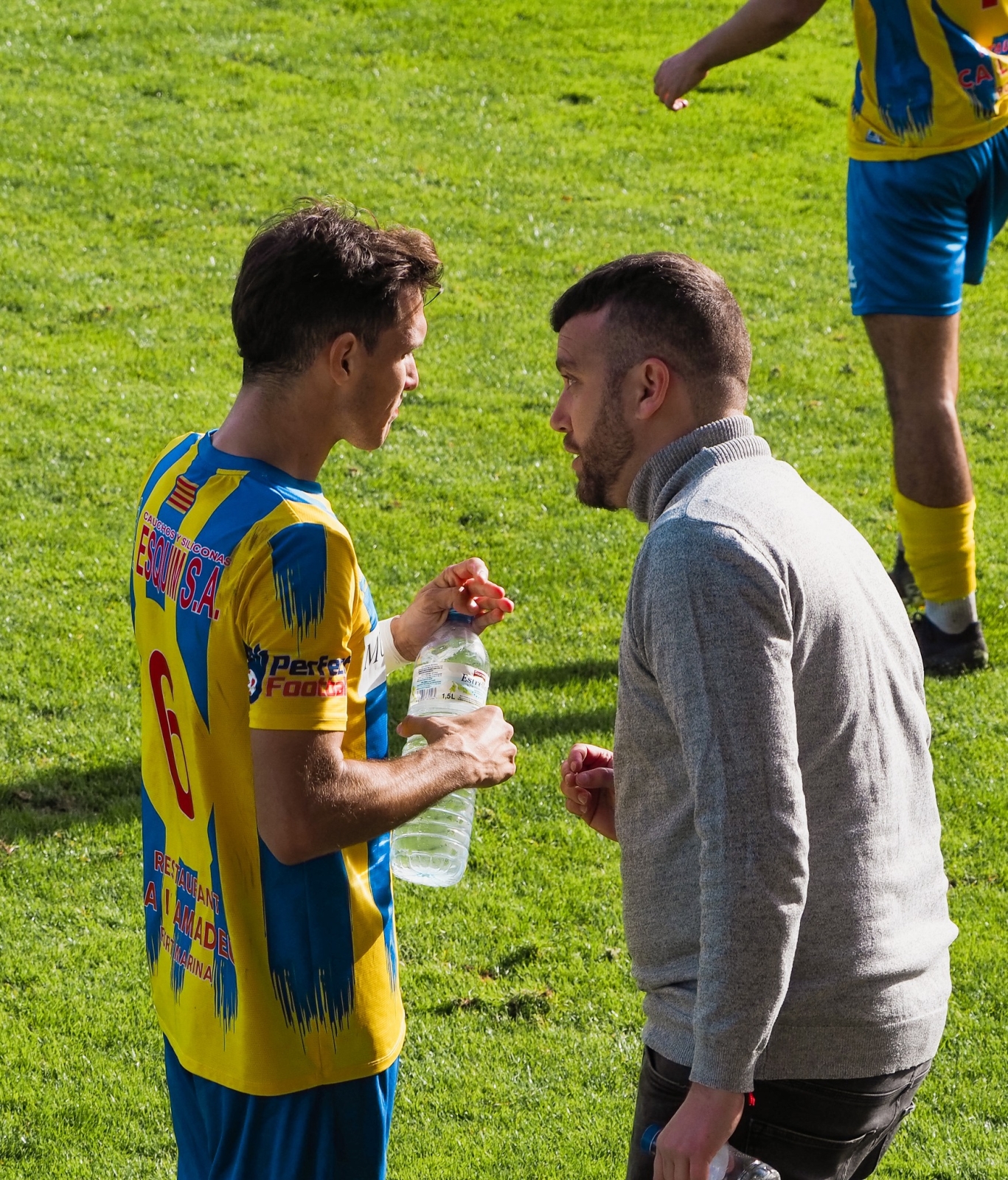 Àlex Redondo amb un dels seus jugadors